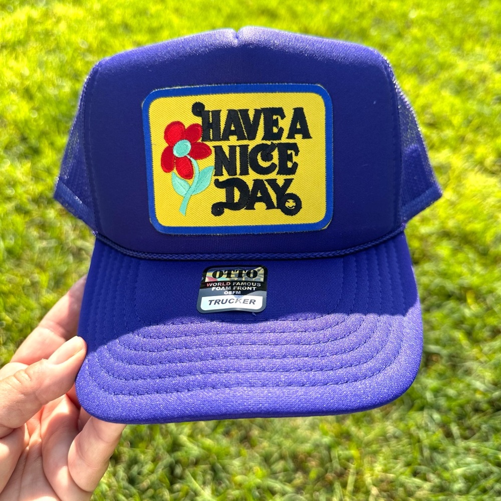 Women’s trucker hat, brand new, with tags, have a nice day
